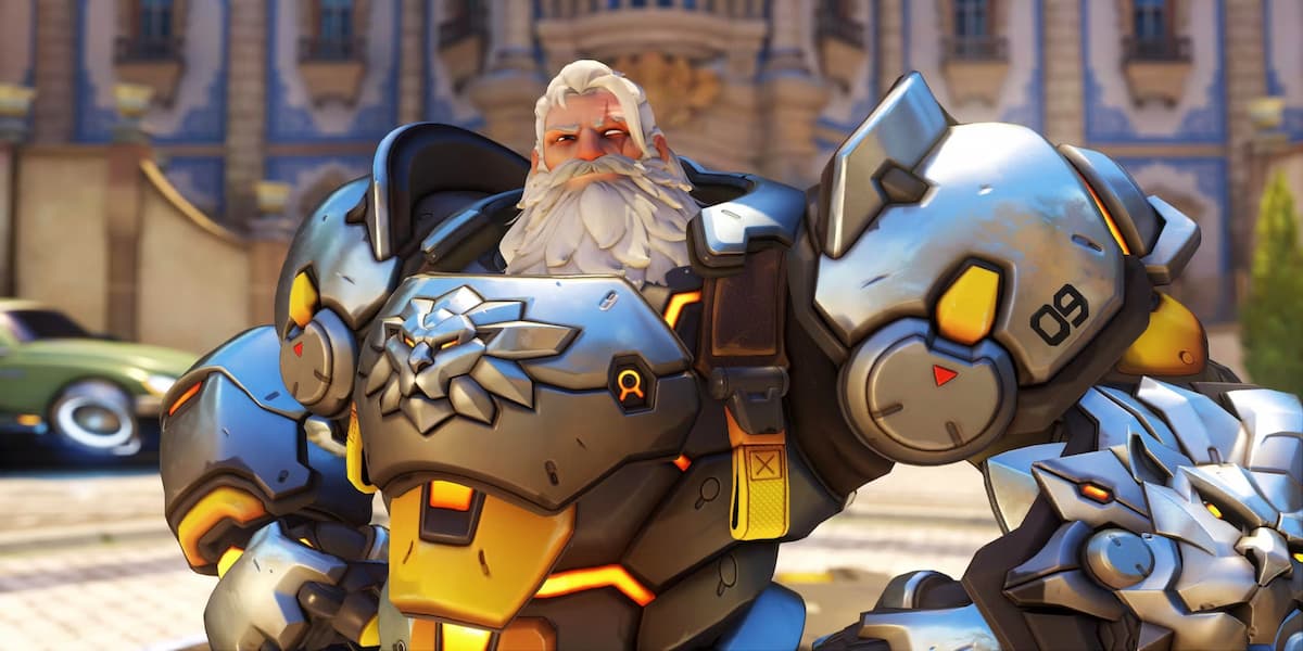 Reinardy in a suit of silver armor with a lion on the chest smiles in OW2